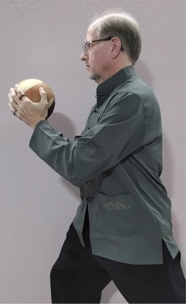 Modern YMAA Tai Chi Ball used during forward rolling stance